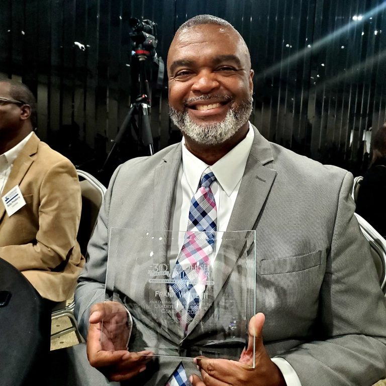 Southwestern client accepts leadership award