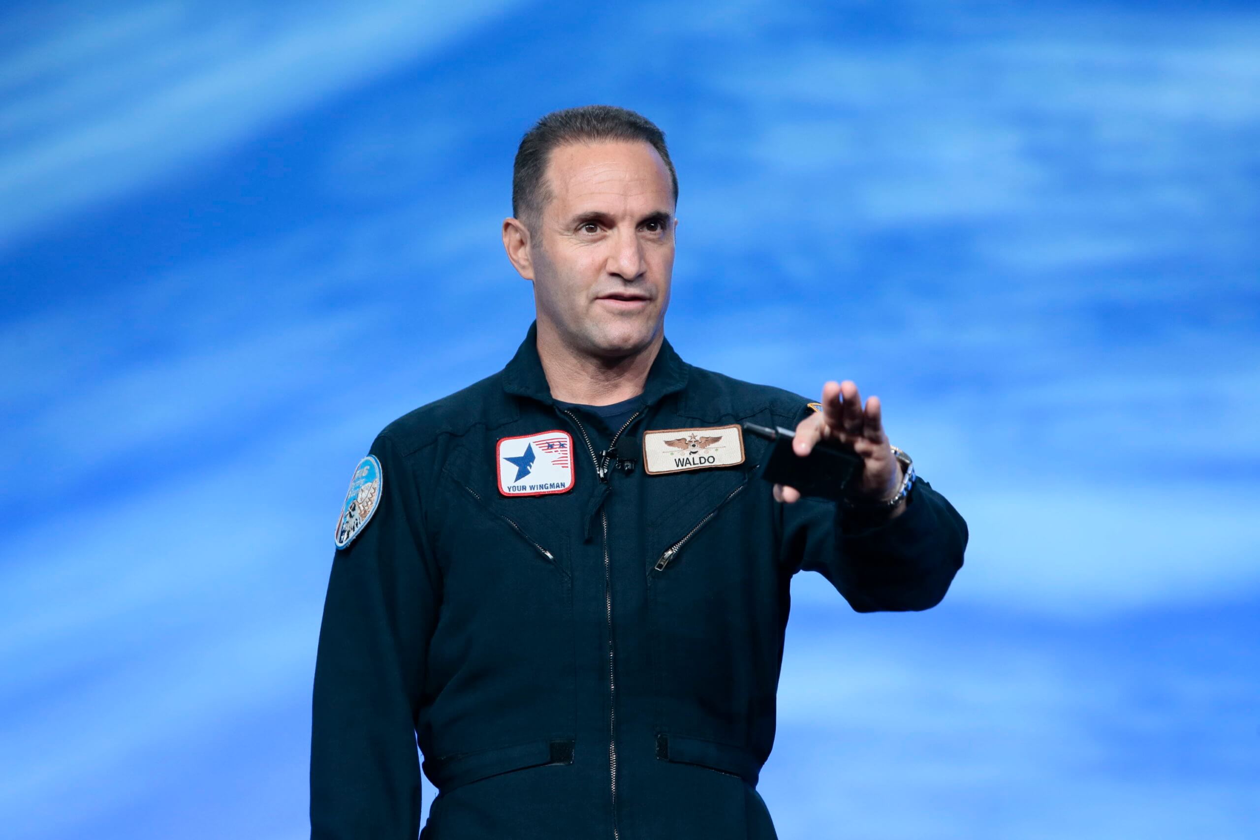 Waldo Waldman speaking on stage